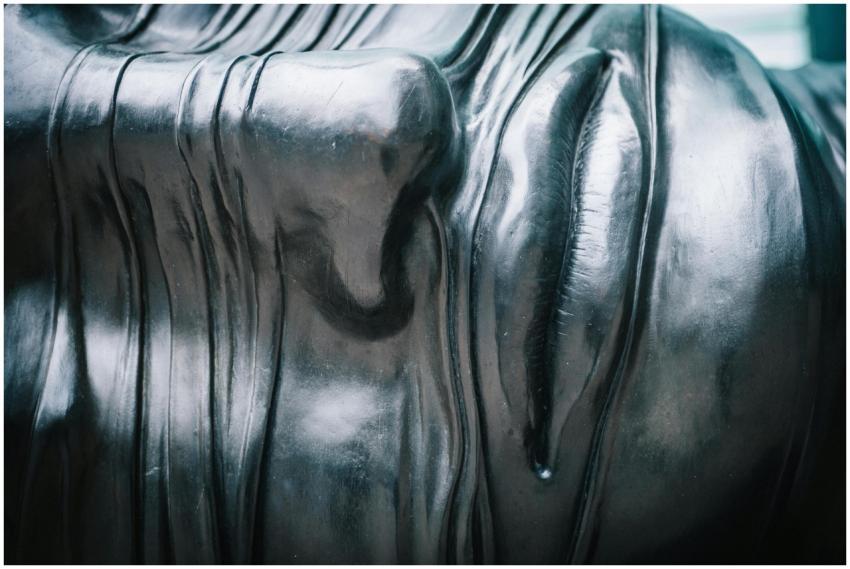 Close-up view of a textured metallic sculpture emp