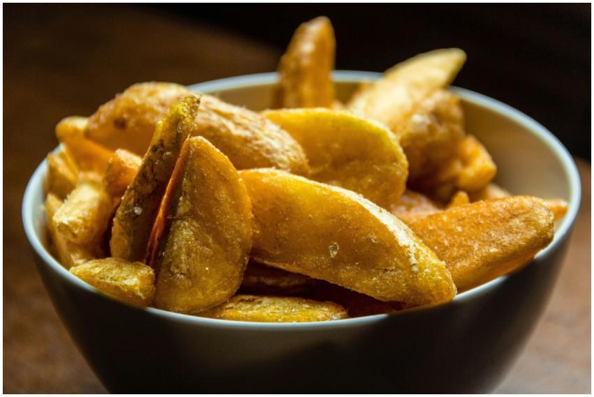 Crispy golden potato wedges seasoned and served in