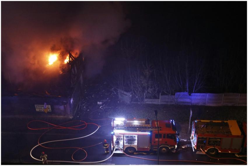 Aerial view of firemen tackling a nighttime buildi