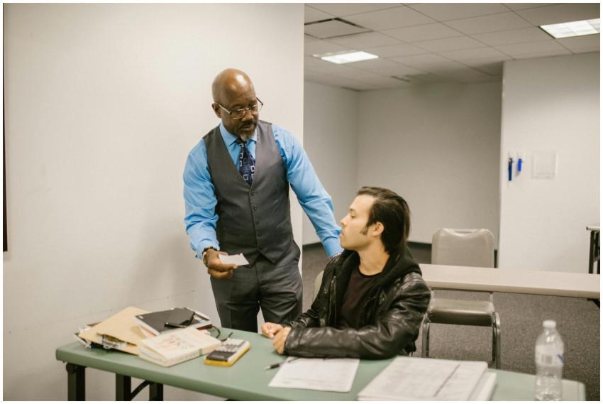 A teacher addresses a student caught with a cheat