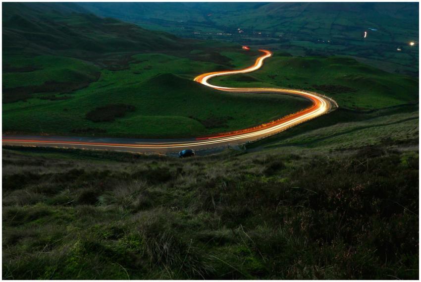 Majestic night view of light trails on a winding r
