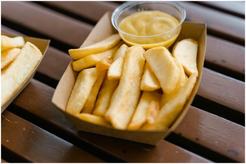 Close-up of delicious crispy French fries in a car