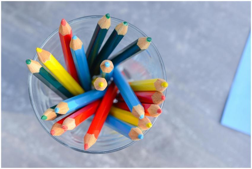 Vibrant colored pencils arranged in a glass, viewe
