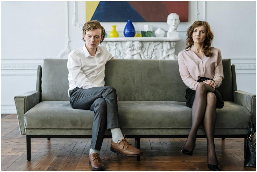 A couple sitting apart during a counseling session