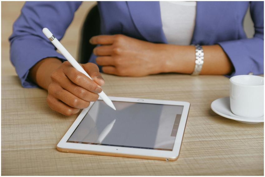 African American woman using a stylus on a tablet