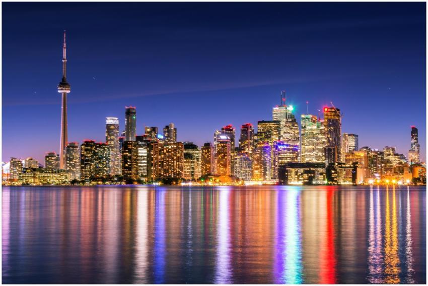 Illuminated Toronto skyline with CN Tower reflecti