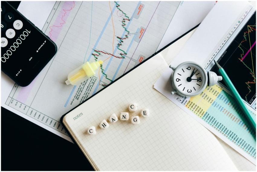 Top view of financial documents with charts, calcu