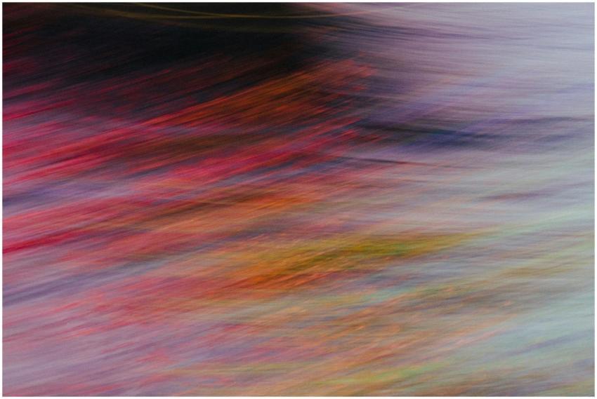A colorful abstract image with dynamic motion blur
