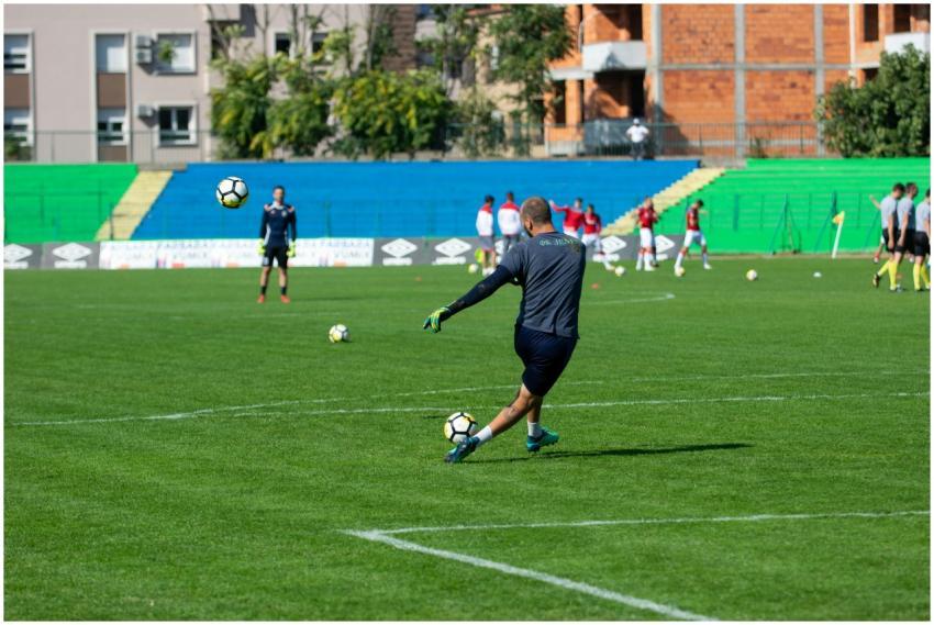 Soccer player kicking a ball during training on a