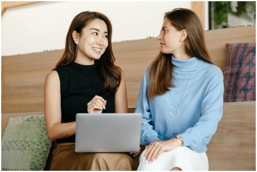 Two diverse women having a cheerful business discu