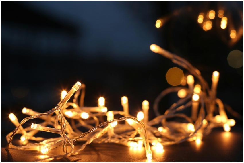 Close-up of warm LED string lights glowing against