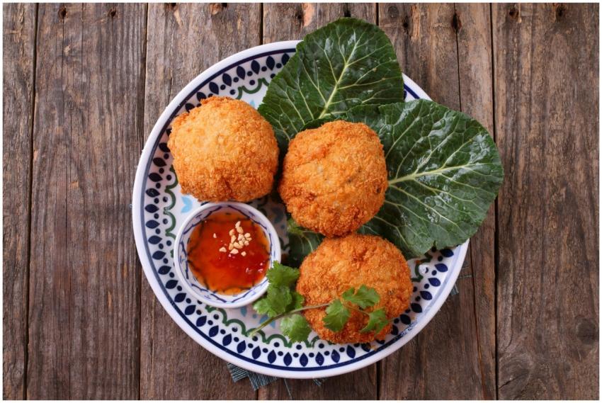 Savor crispy fried croquettes served with chili sa