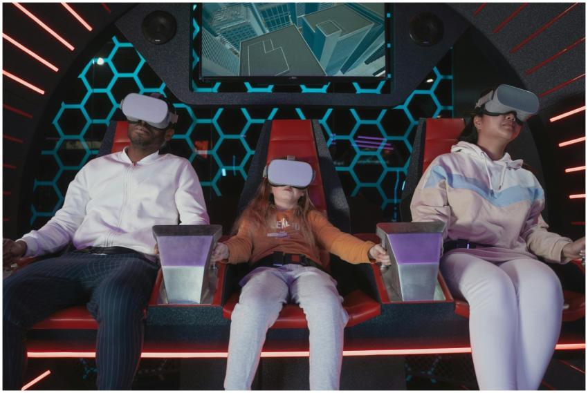 Family enjoying a virtual reality simulator ride i