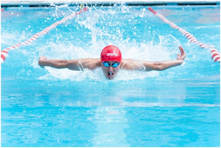 A skilled swimmer performing the butterfly stroke