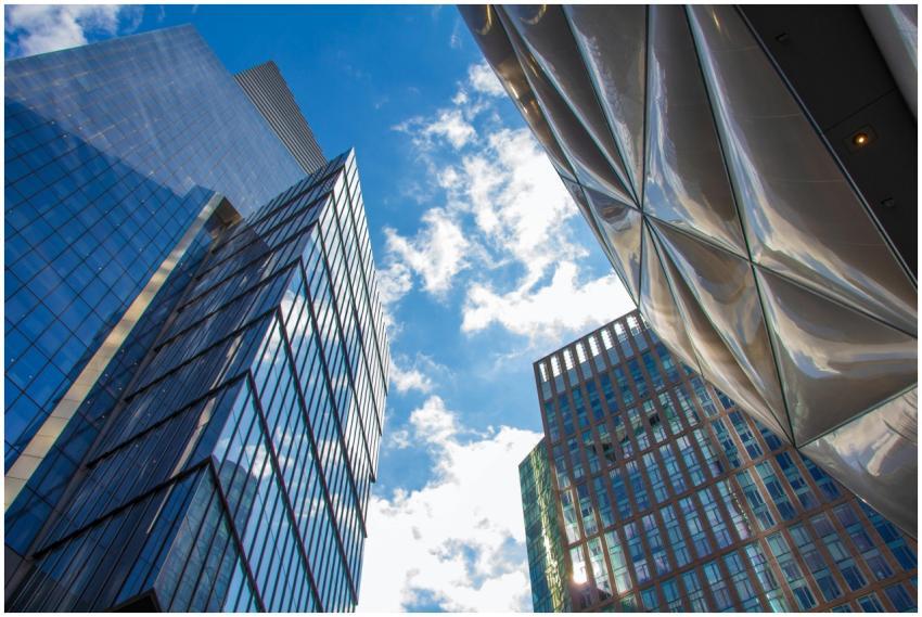 A low angle view of modern skyscrapers with glass