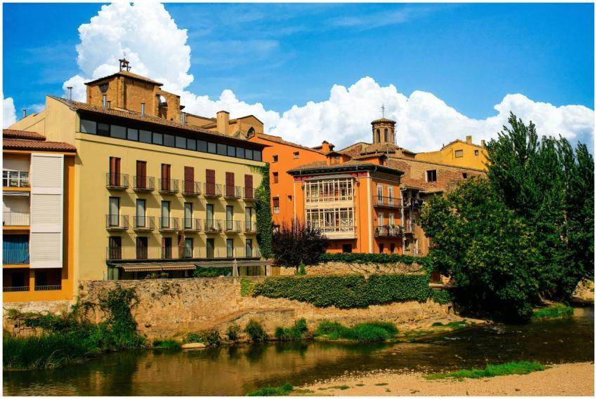Picturesque view of historic buildings along a riv