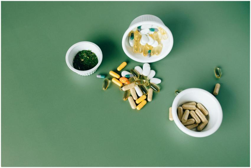 Various herbal and vitamin pills and capsules on a