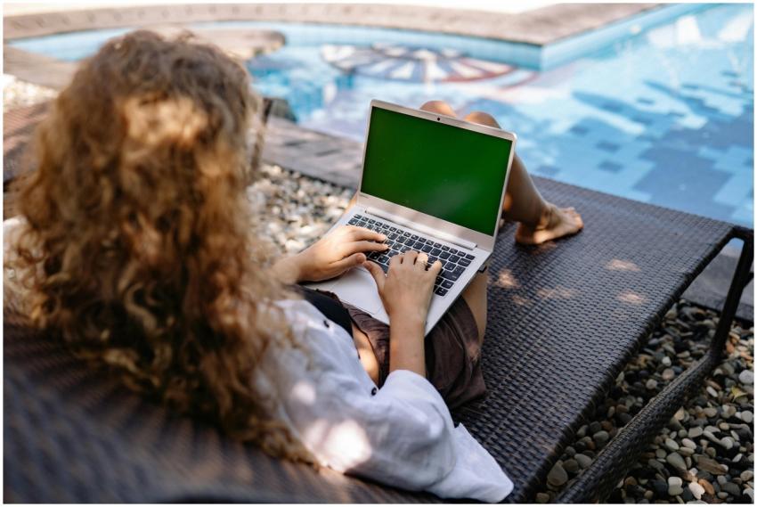 From above back view of anonymous female freelance