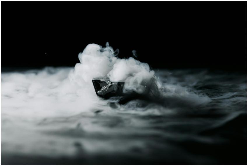 A small boat appears enveloped in dramatic smoke a