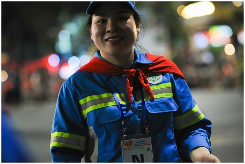 Smiling worker in reflective uniform captured on a
