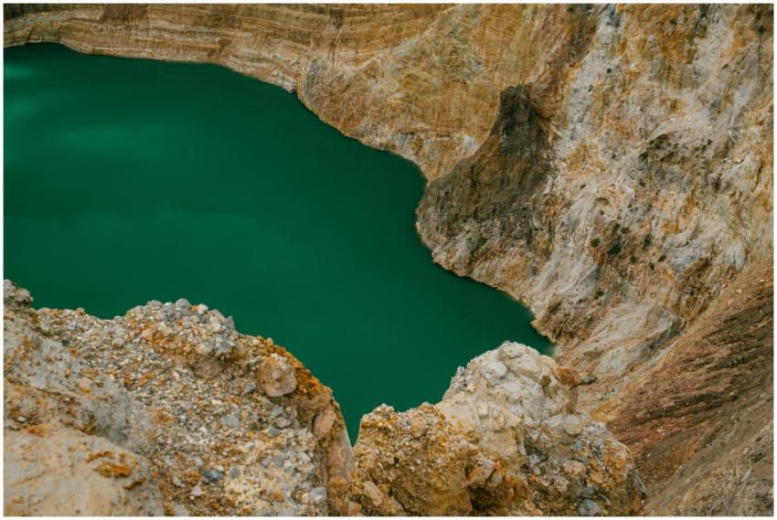 Stunning aerial shot of a bright green crater lake
