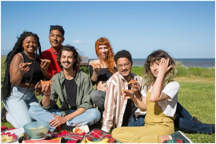 A diverse group of young friends enjoying a sunny