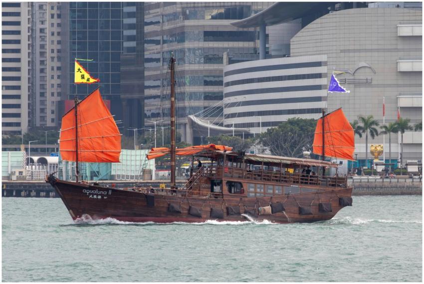 A traditional Chinese junk boat sails through Hong