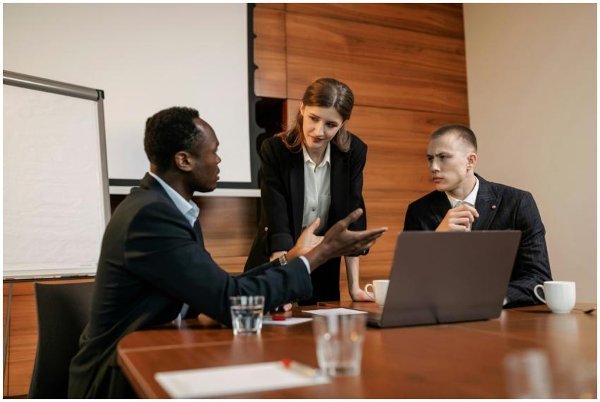 Three colleagues engaged in a serious business mee