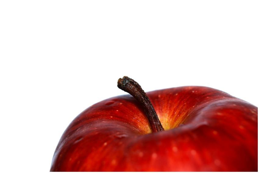 A detailed view of a fresh red apple against a whi