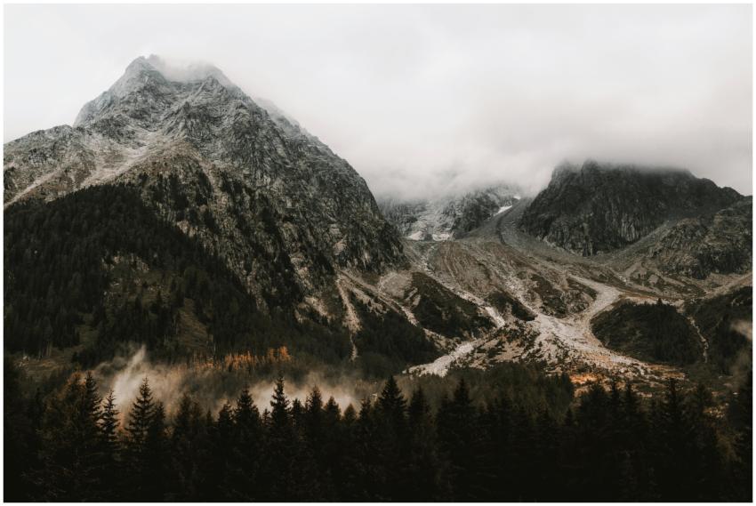 Explore the serene beauty of foggy mountain peaks