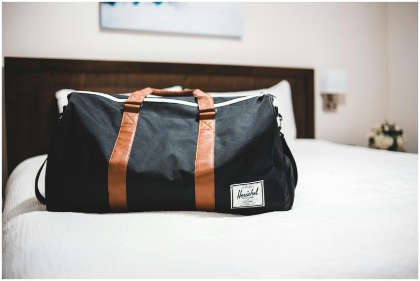 Contemporary baggage bag with inscription on white