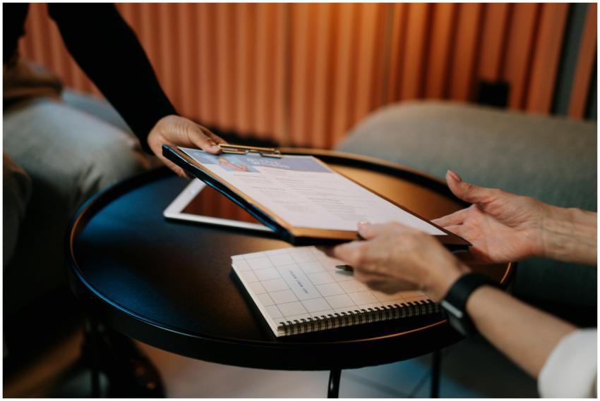 Business professionals exchanging resume during me