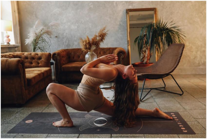 A woman practicing yoga indoors, capturing a momen