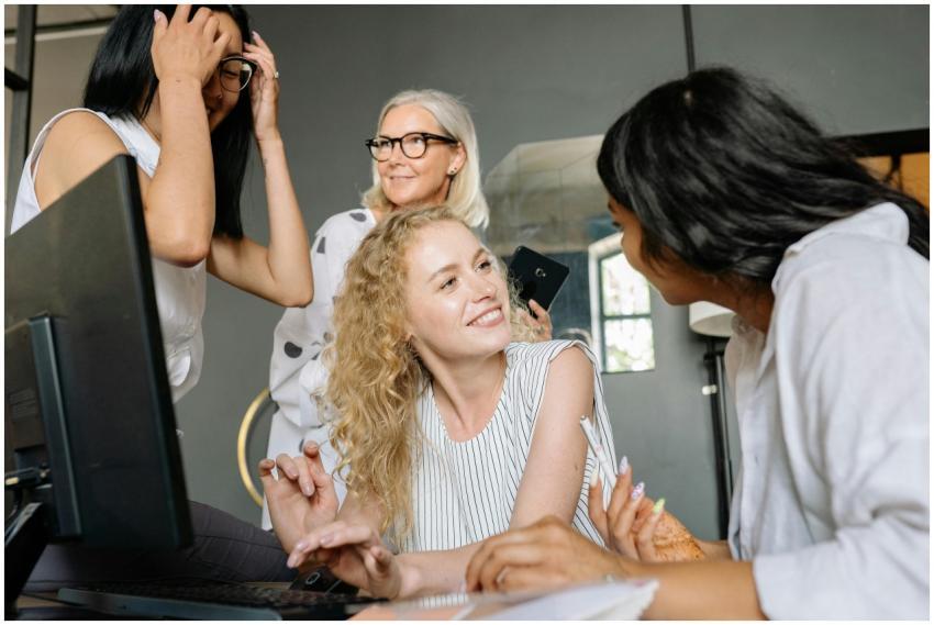 A dynamic group of diverse businesswomen collabora