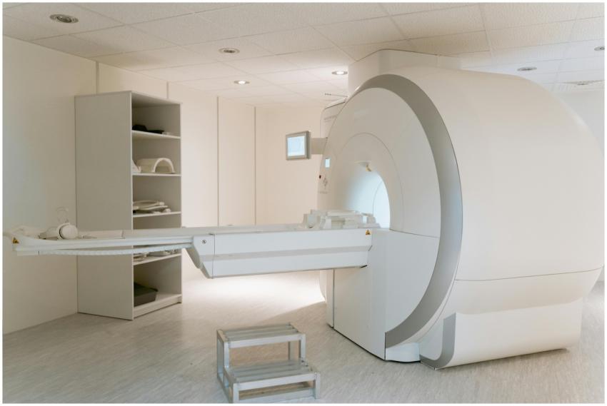Interior view of a modern MRI scanner room, showca