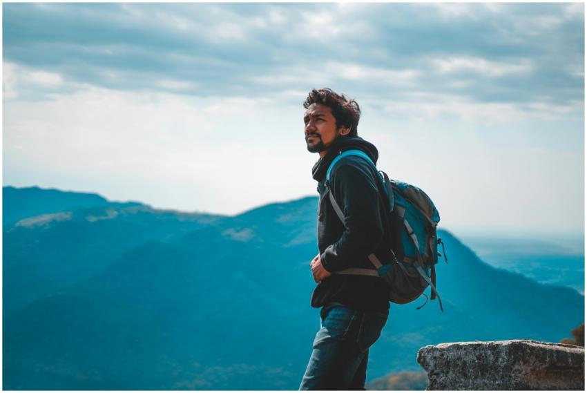 Man enjoying a scenic mountain view in India, capt