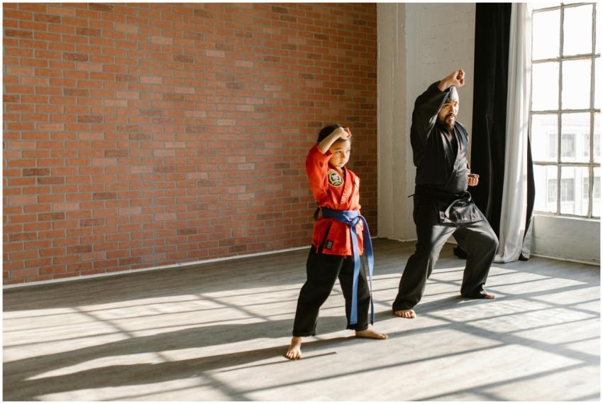 Child and adult practicing karate in a sunlit room