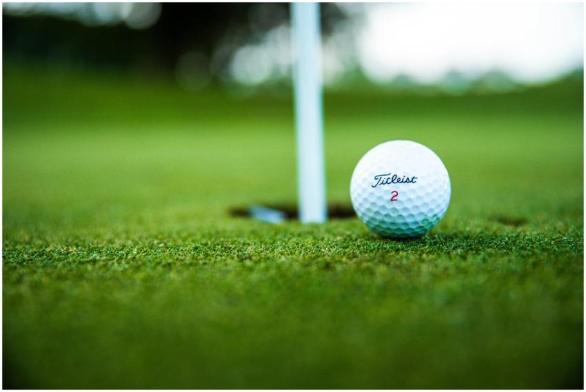 A close-up shot of a Titleist golf ball close to t