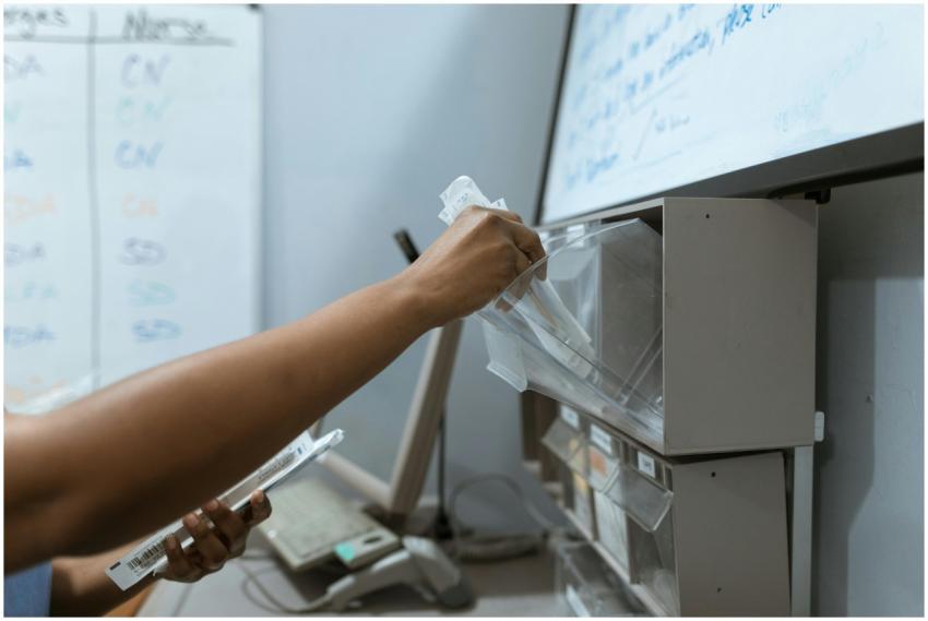 A healthcare worker organizing syringes in a clini