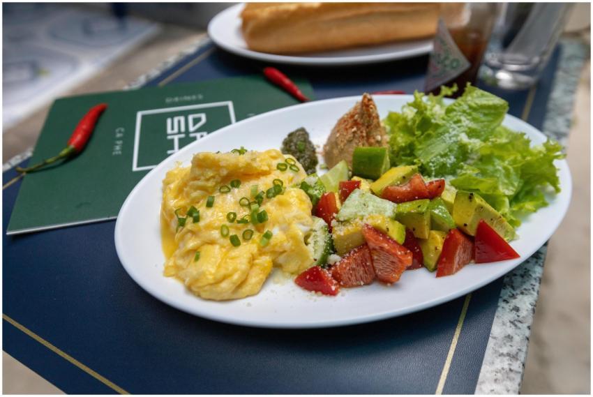 Scrumptious breakfast featuring scrambled eggs, fr