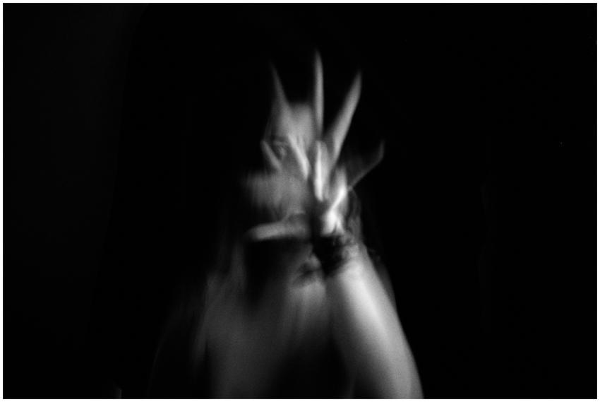 Artistic black and white image of a blurred hand r
