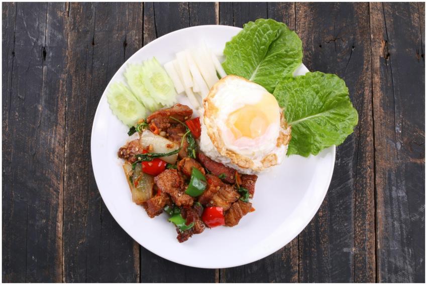 Delicious Thai stir-fried pork served with rice, e