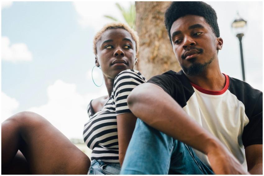 A young couple enjoying a relaxed moment outdoors