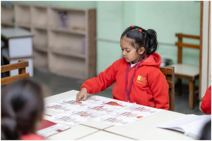 Child engaging in educational activity at school d