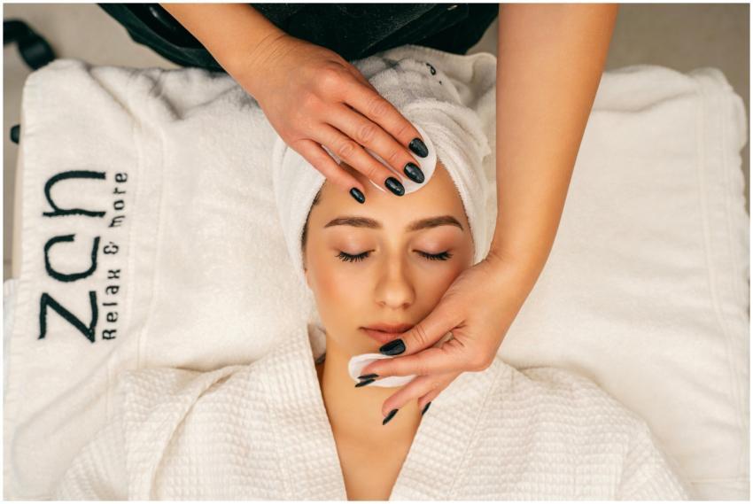 A woman receiving a soothing facial massage at Zen