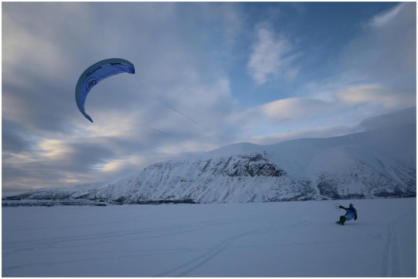 A thrilling snowkiting experience on snowy slopes