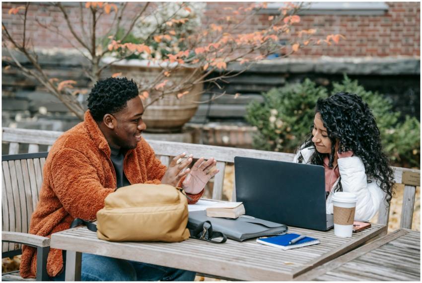 Cheerful multiracial students speaking and smiling