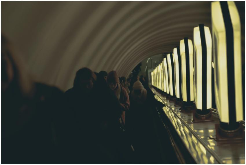 Passengers on an escalator in Kiev metro with atmo