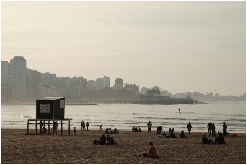 Sunny day at Mar del Plata beach with tourists enj