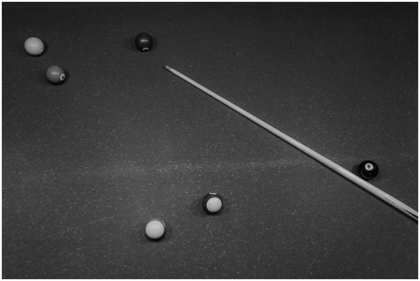 Artistic black and white photo of a billiards tabl
